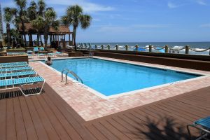 Oceanfront swimming pool with Myrtle Beach in the background