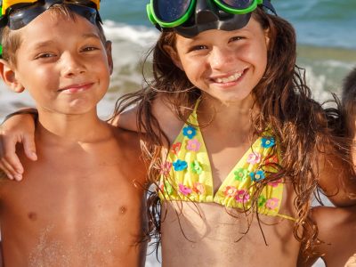 kids posing together at the beach