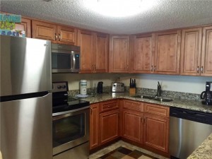 full kitchen with stainless appliances and granite countertops